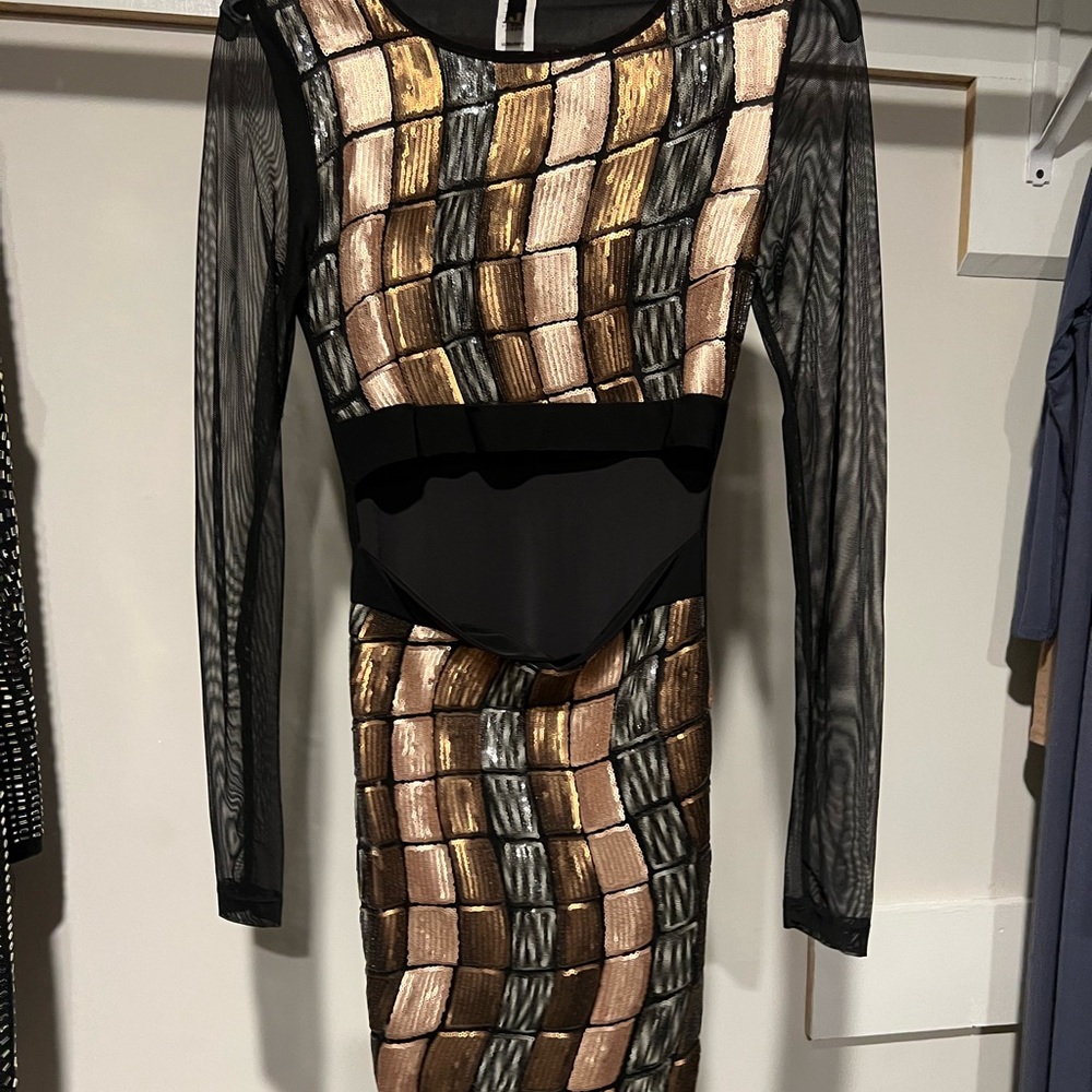 Black dress with silver and gold design, size medium,worn once